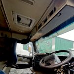 Interior of Volvo FM 400 truck tractor showing driver and passenger seats, dashboard, clean ex-fleet condition