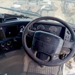 Volvo FM 400 dashboard and steering wheel from driver seat, I-Shift gear lever, well-maintained interior